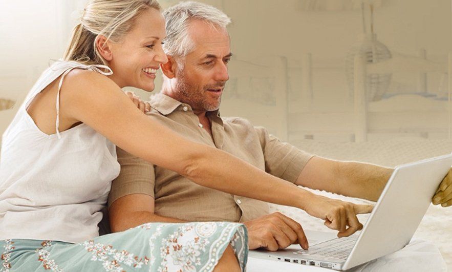 A couple making arrangements together at home